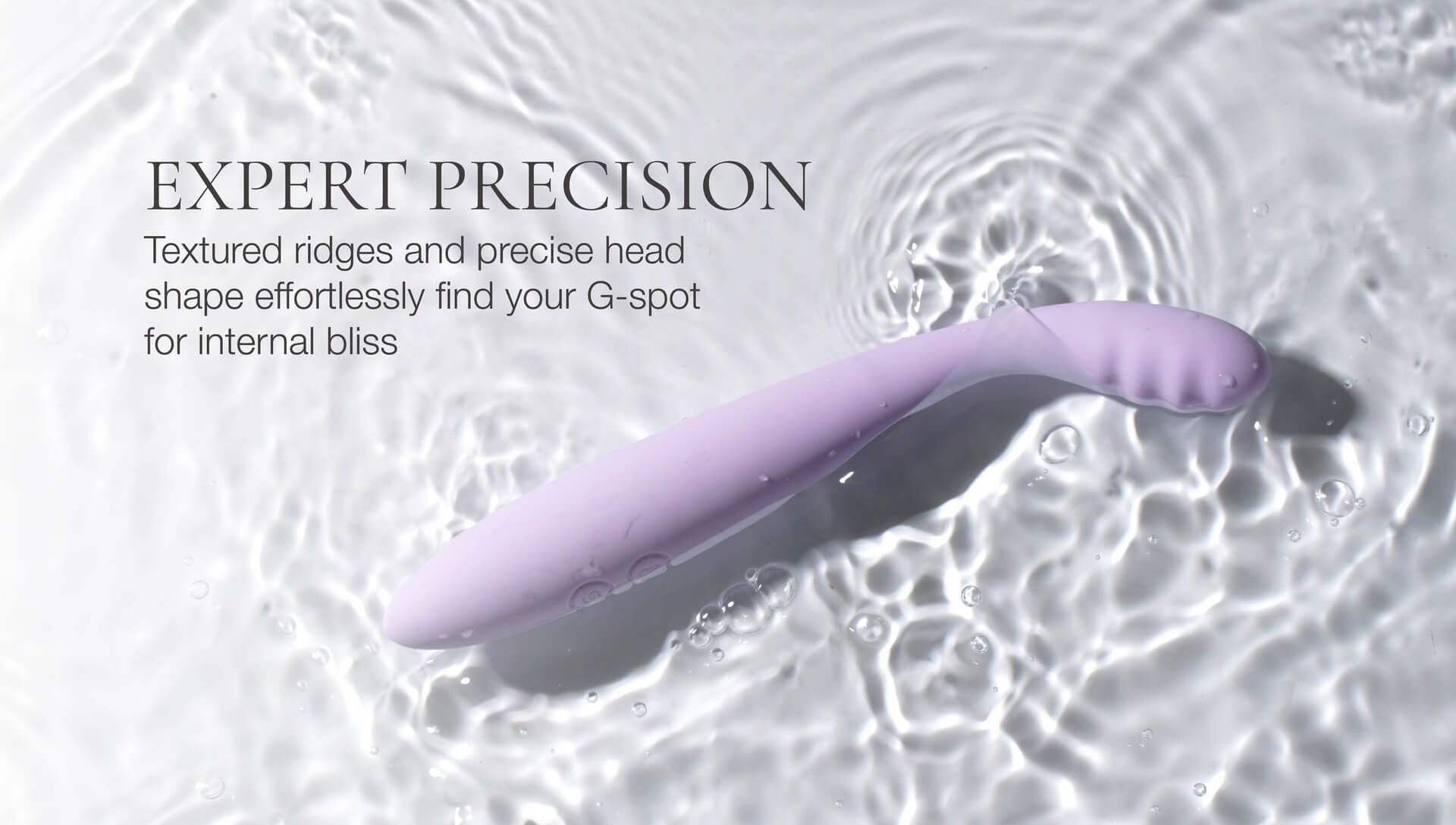 Purple G-spot stimulator on water with text about expert precision
