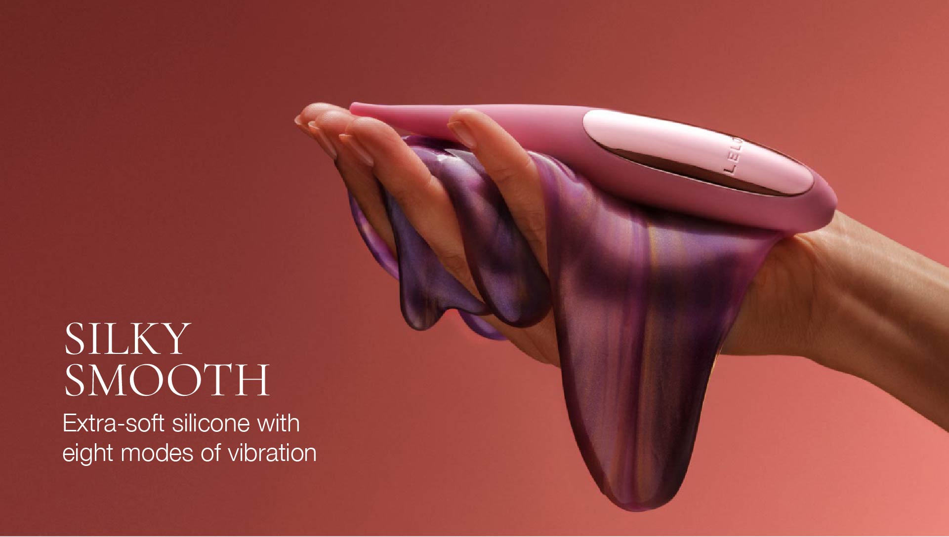 Purple silicone massager with text on a red background