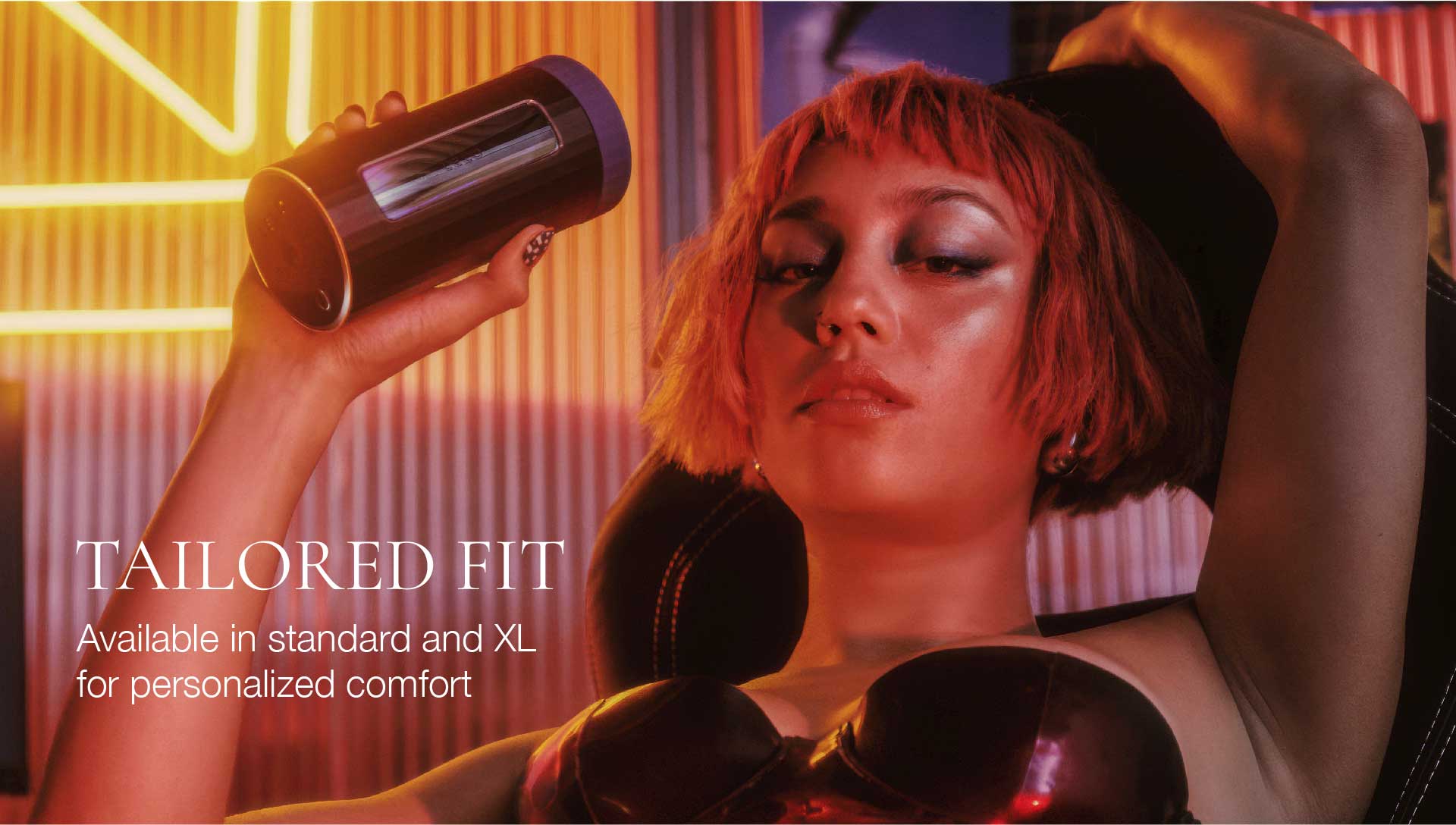 Woman lifting weights with a neon sign in the background, promoting 'Tailored Fit' product.