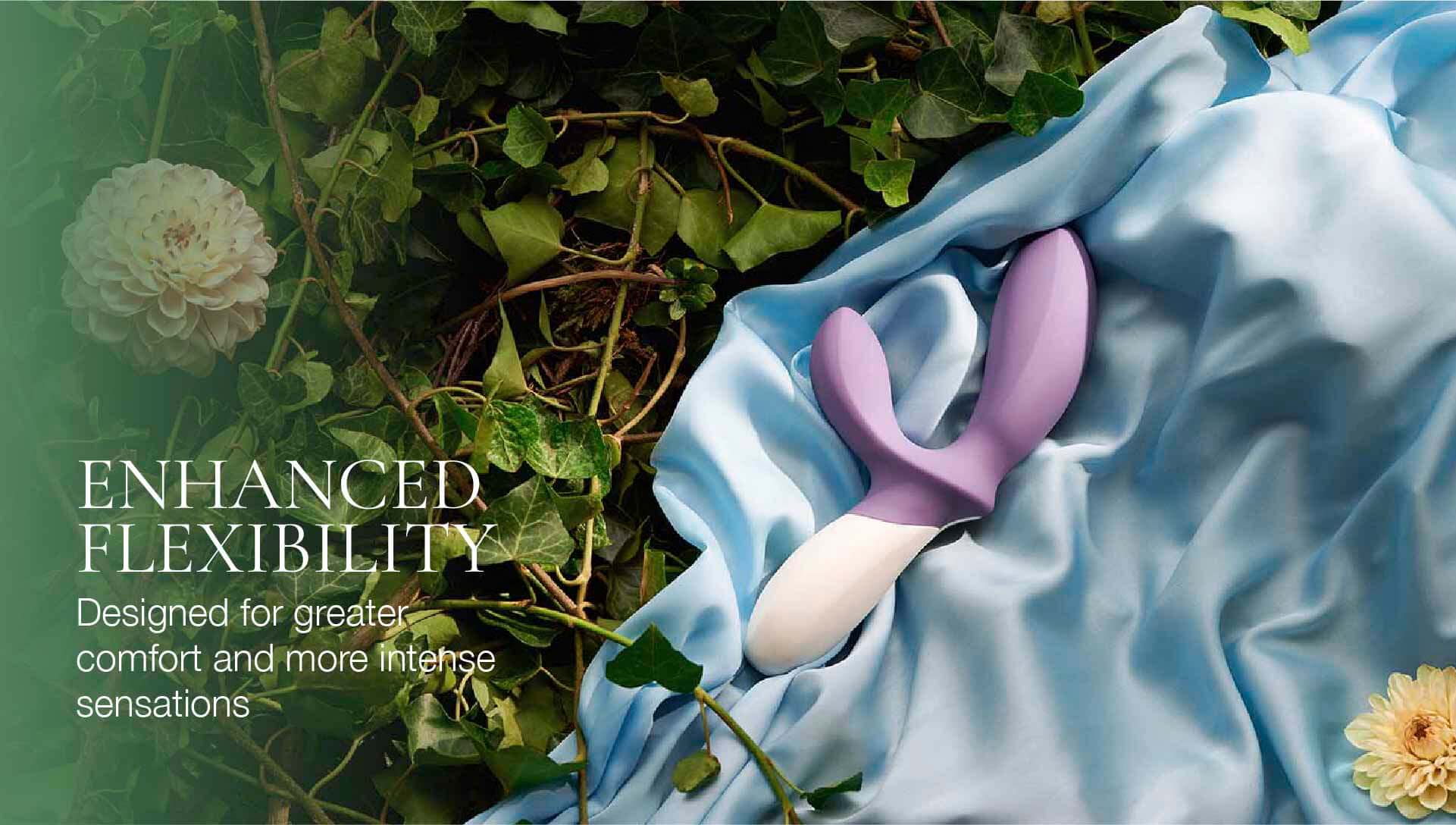 Purple and white device on a blue fabric with green leaves and flowers in the background