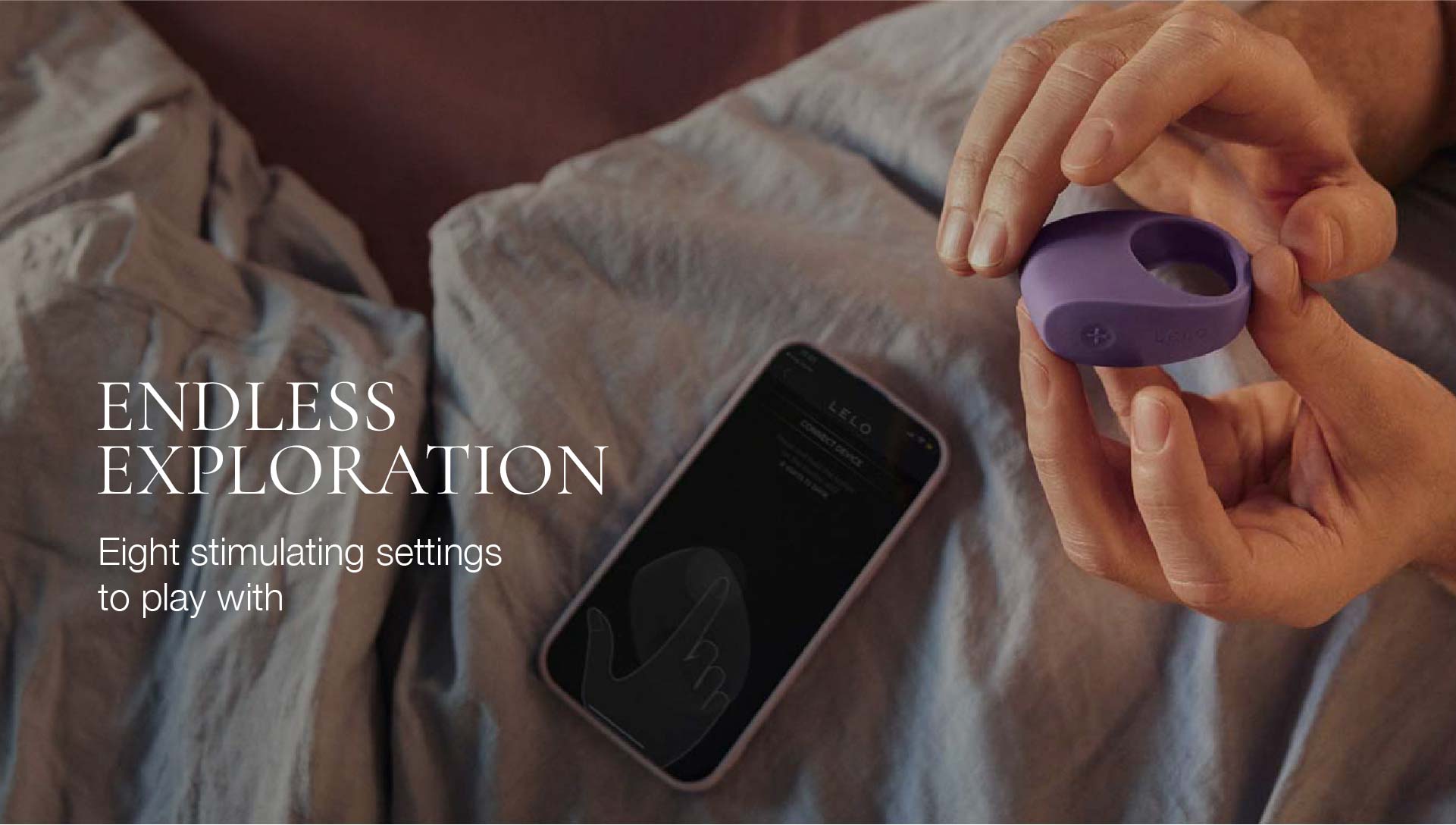 Person holding a purple ring with text about endless exploration and eight stimulating settings.