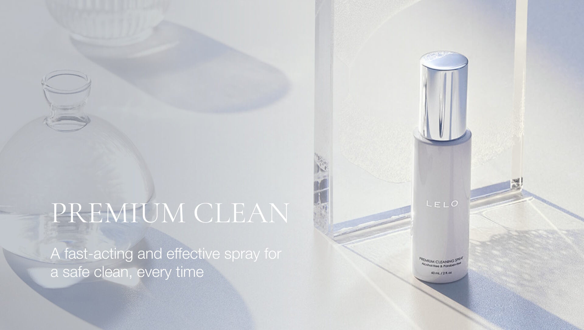 Spray bottle labeled 'LELO' on a reflective surface with text about its effectiveness.