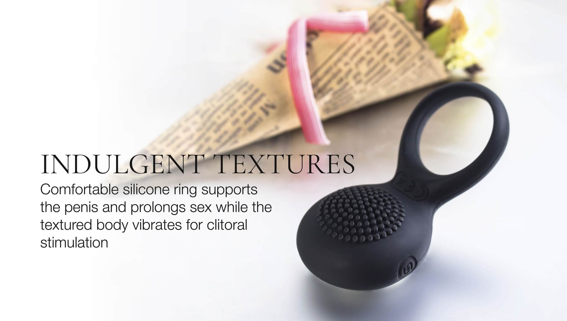Black silicone ring with text describing its features on a white background