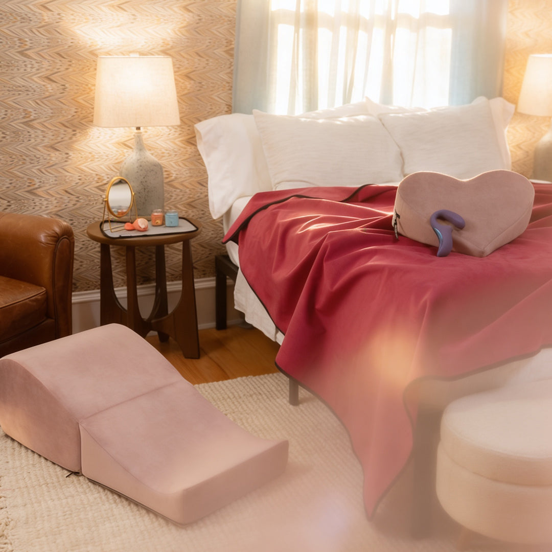 Cozy bedroom with a bed, ottoman, and side table.