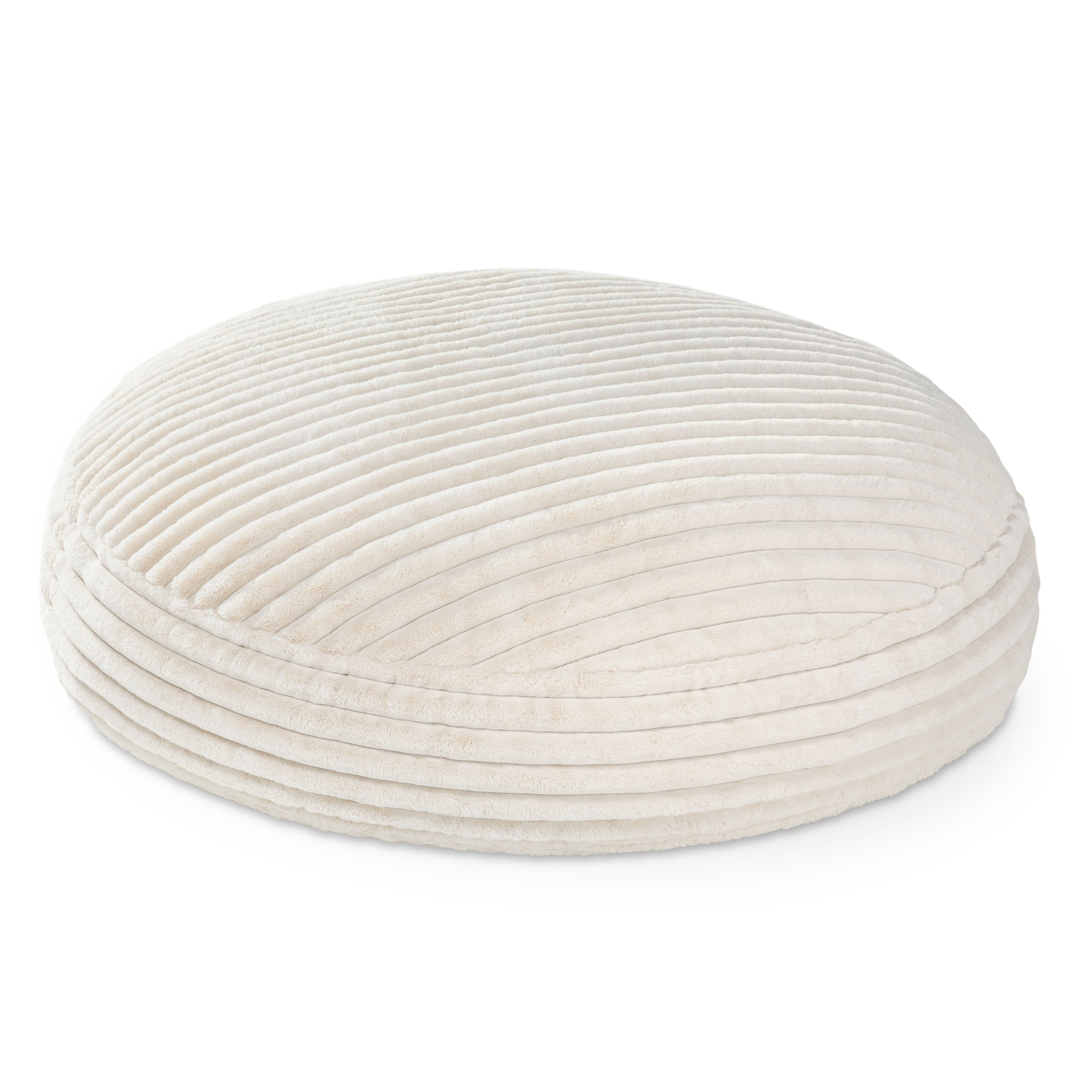 Round, beige fabric ottoman on a white background