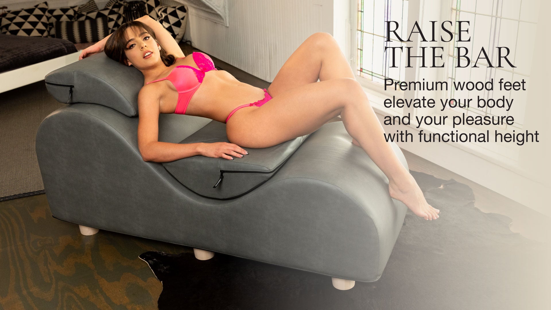 Woman in pink lingerie lying on a gray chaise with text about premium wood feet.