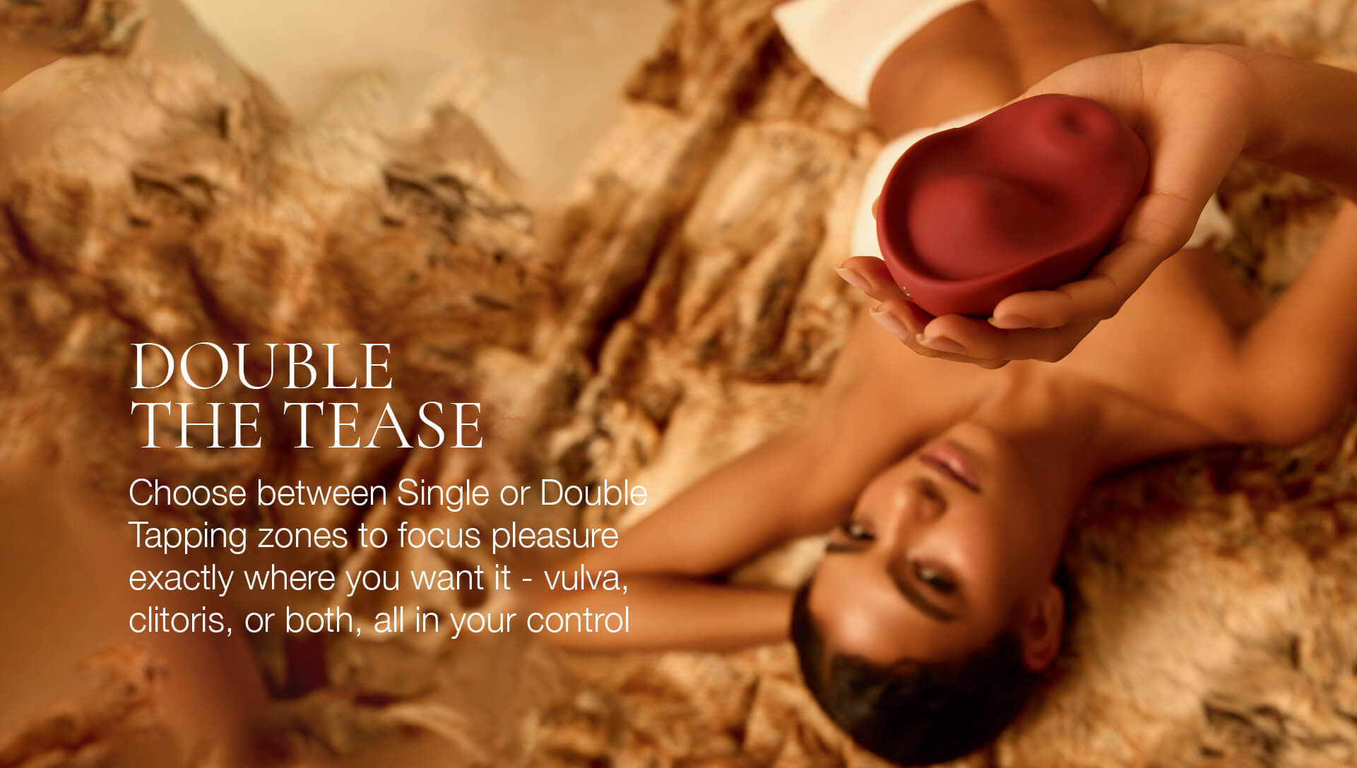 Person lying on a rocky surface with a red vibrator, promotional text for a product.
