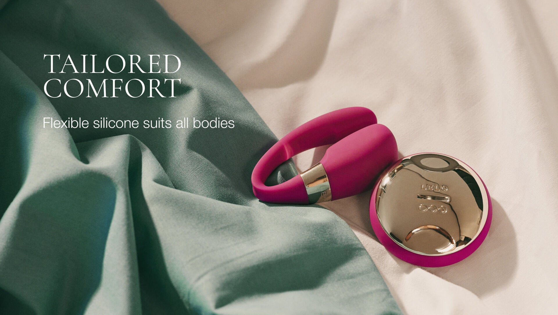 Pink silicone ring with gold accents on a light fabric background, featuring text about tailored comfort.