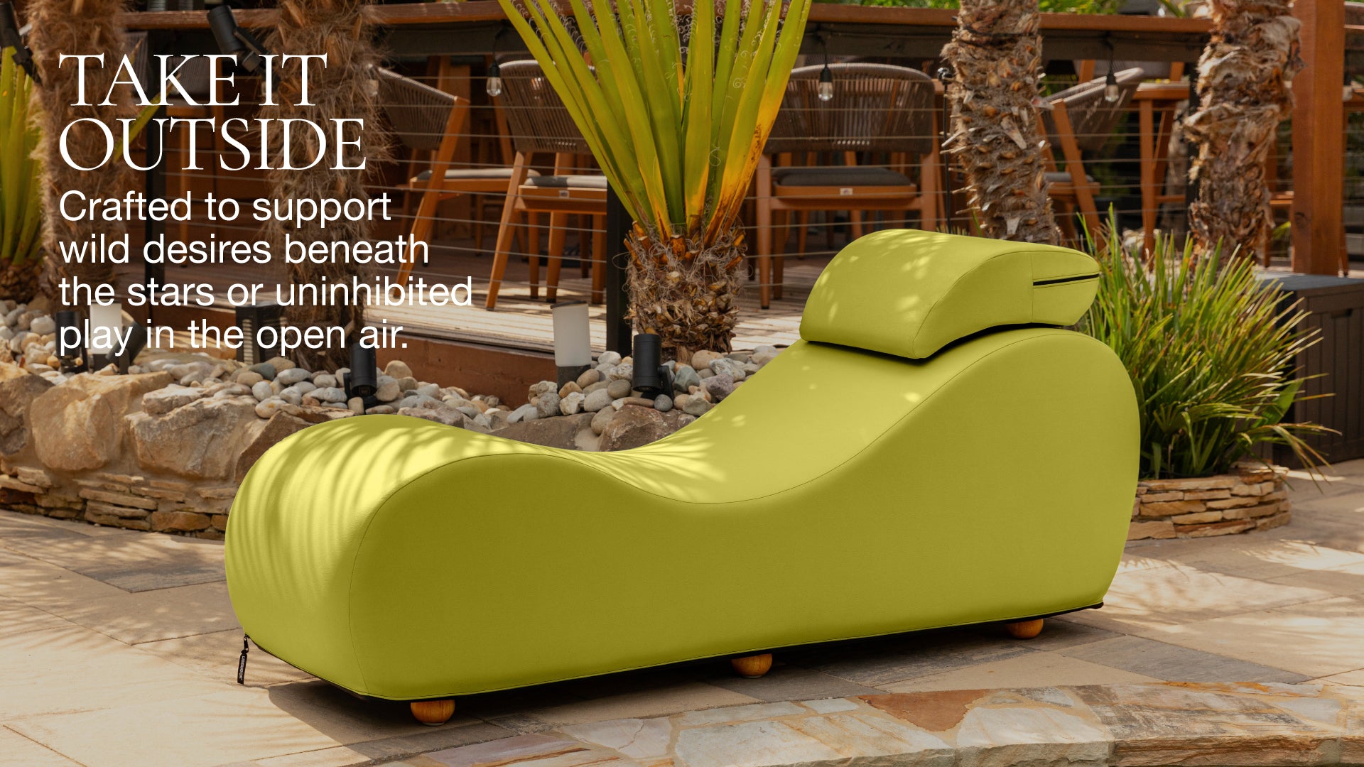Green outdoor lounge chair in a patio setting with text about supporting wild desires.