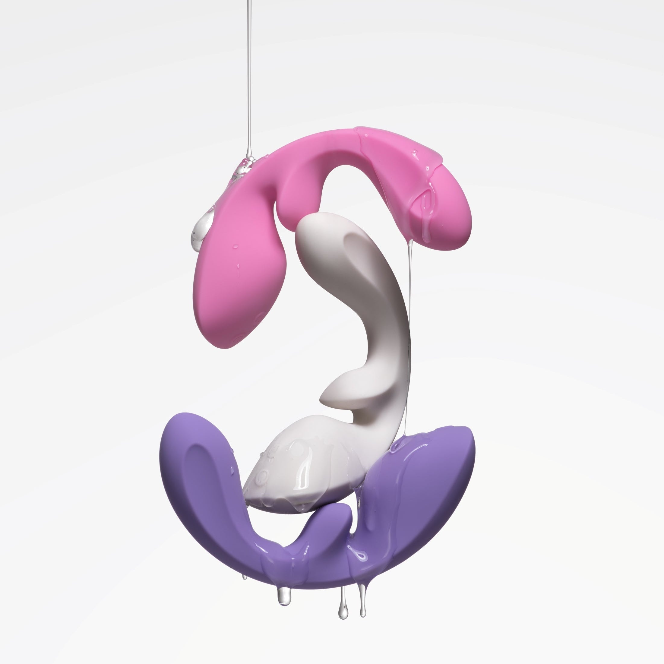 Colorful vibrators with pink, white, and purple design on a white background