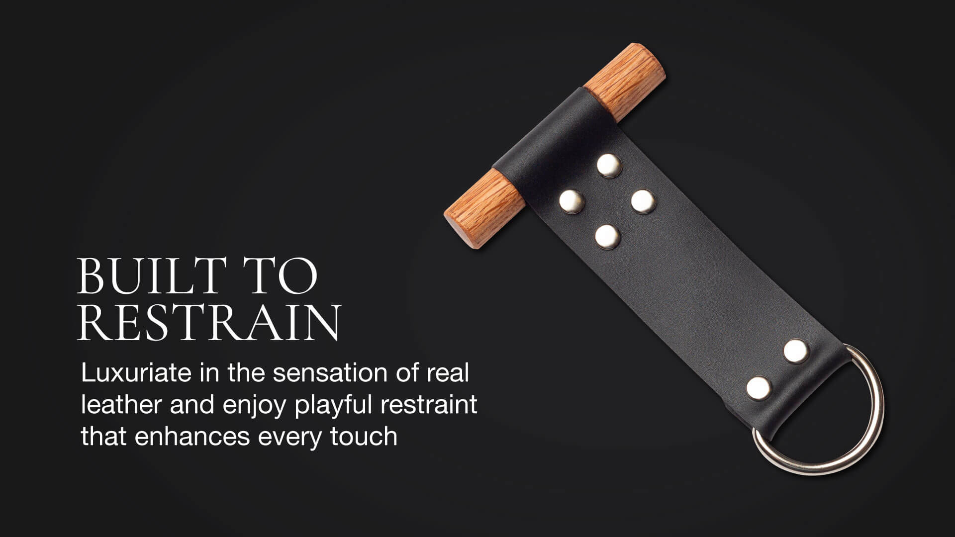 Black leather restraint with wooden handle on a dark background, featuring text about its use.