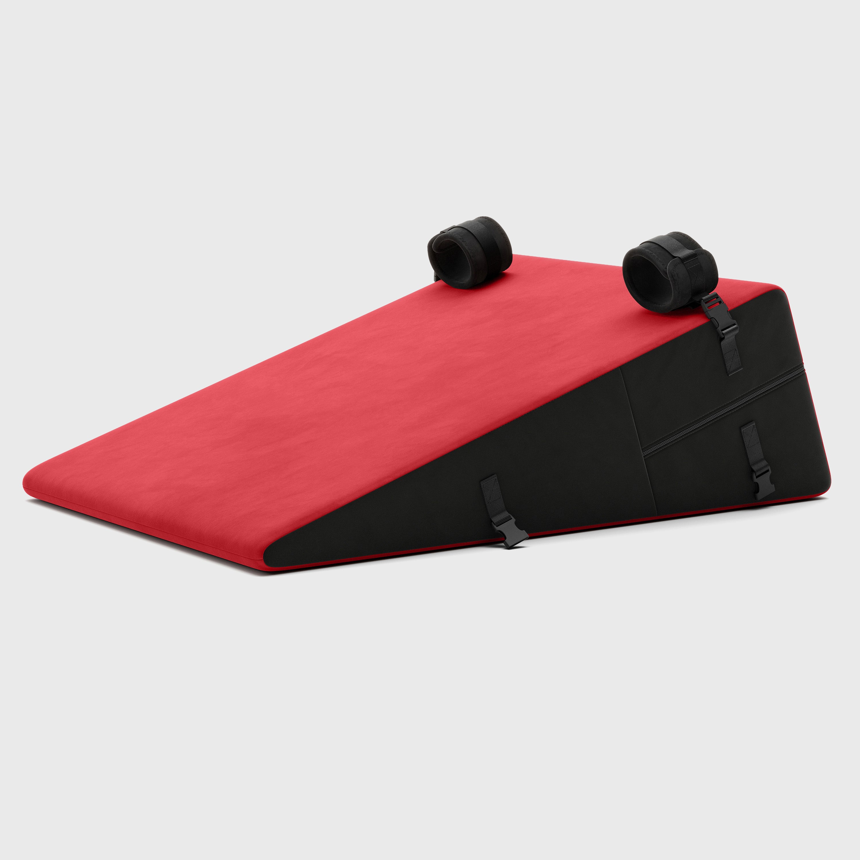 Red and black wedge-shaped product on a light gray background