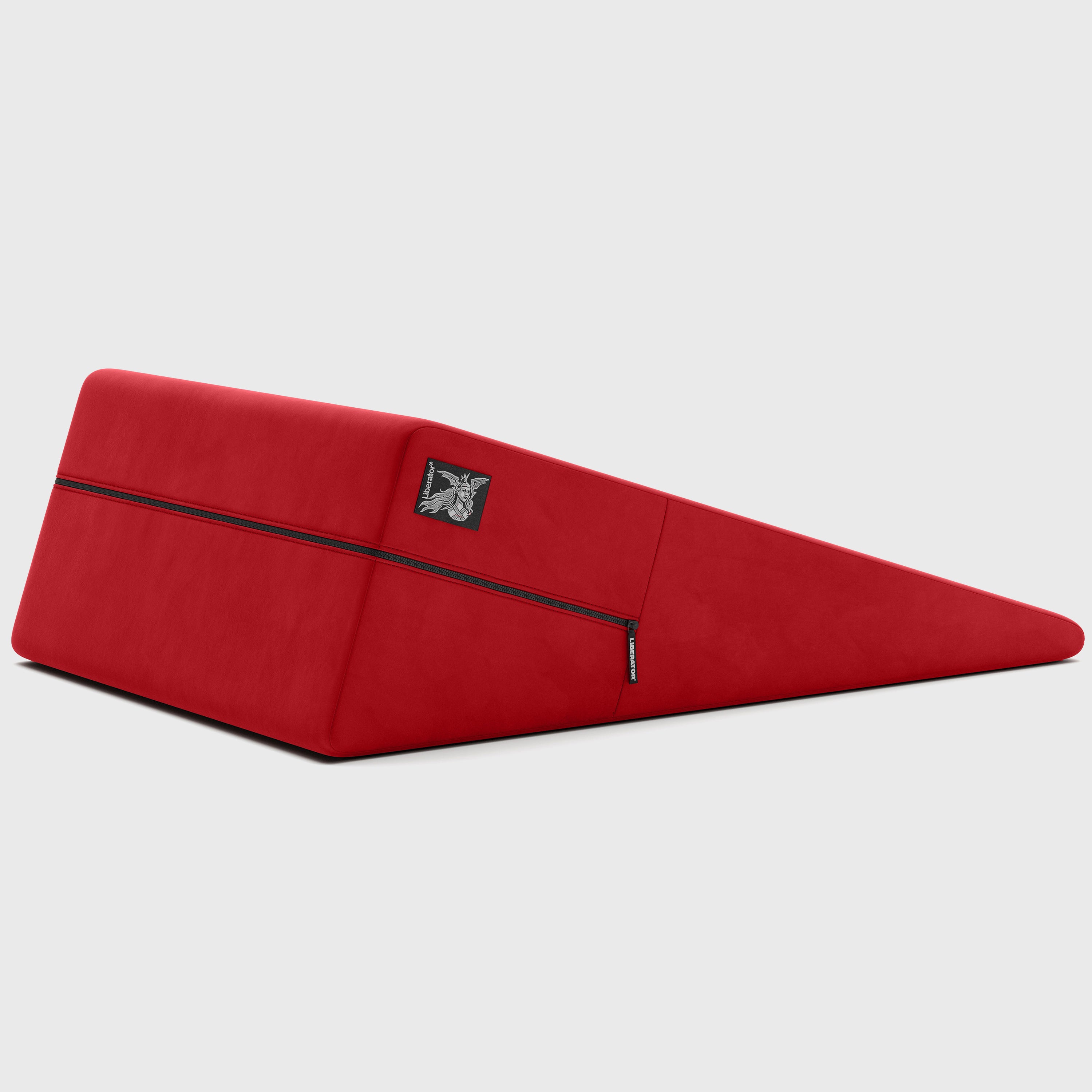 Red ramp pillow with a brand logo on a light gray background
