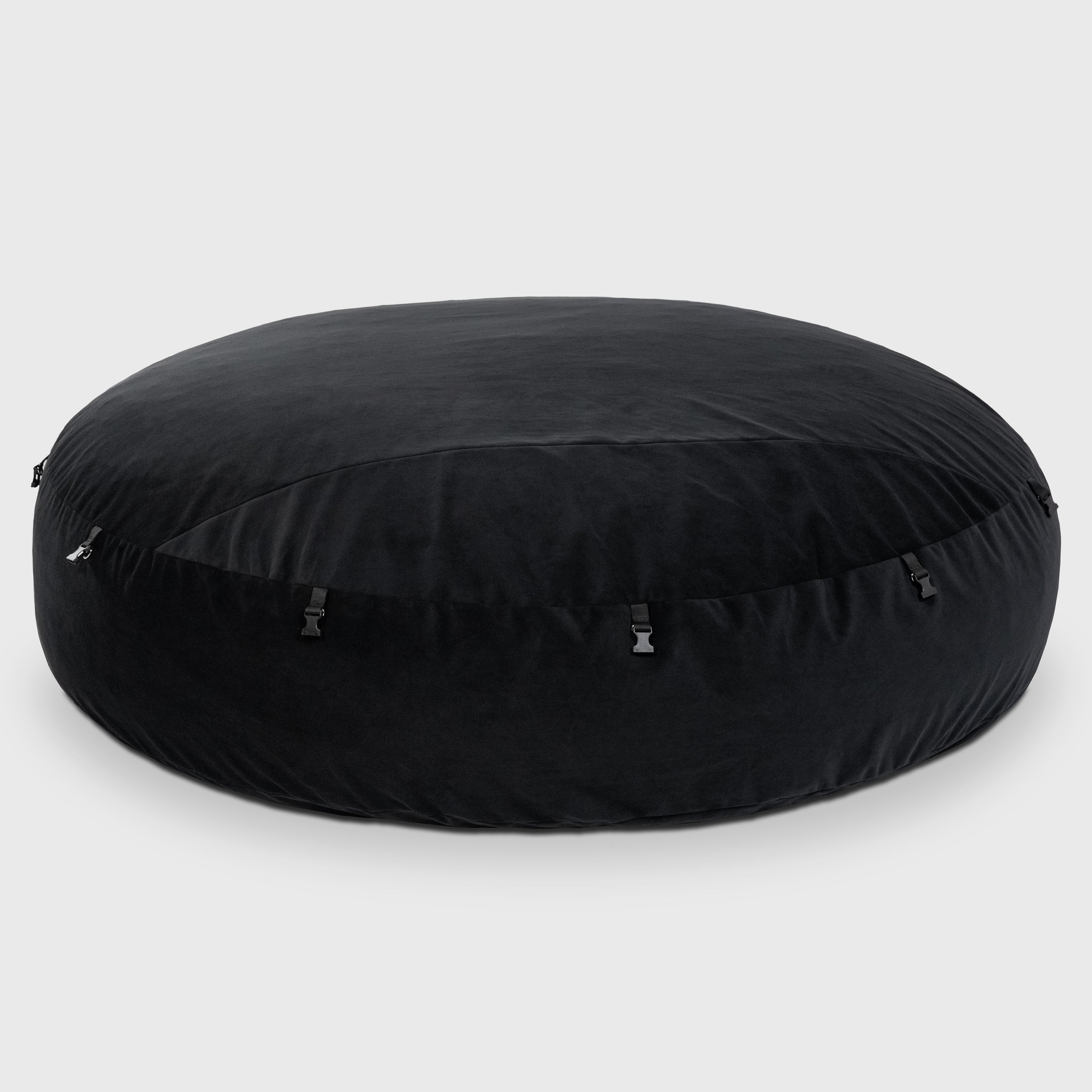 Black round cushion on a white background