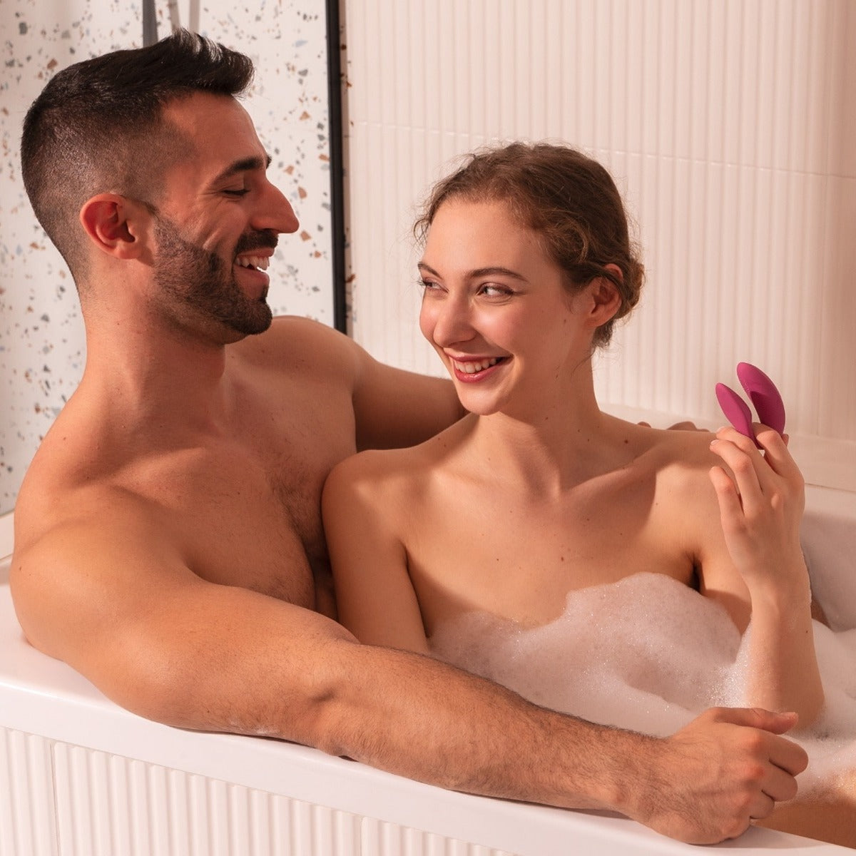 Couple in bath with We-Vibe Sync 2