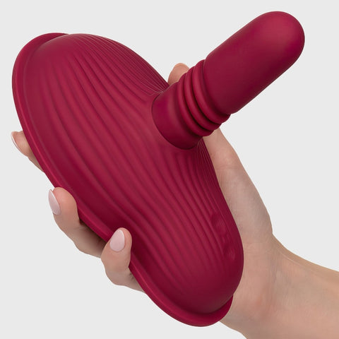 hand holding  Cal Exotics Dual Rider Thrust & Grind