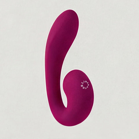 Pink silicone vibrator on a white background