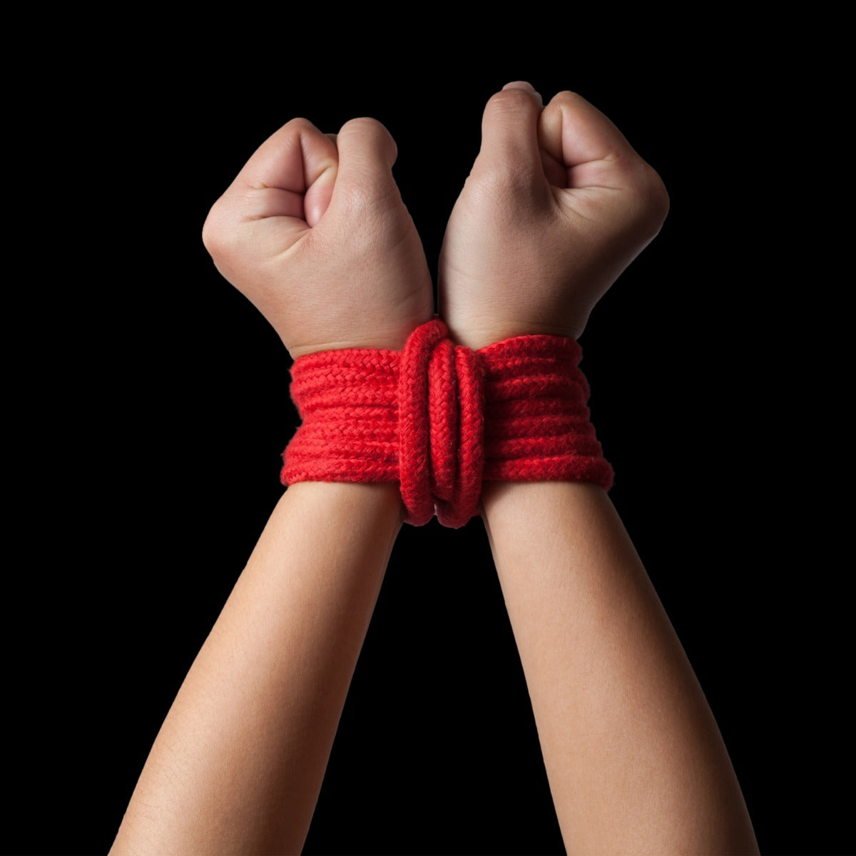 Wrists tied up by Liberator Bondage Rope
