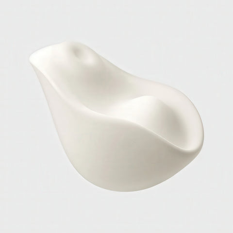 White silicone teardrop-shaped vibrator on a light gray background