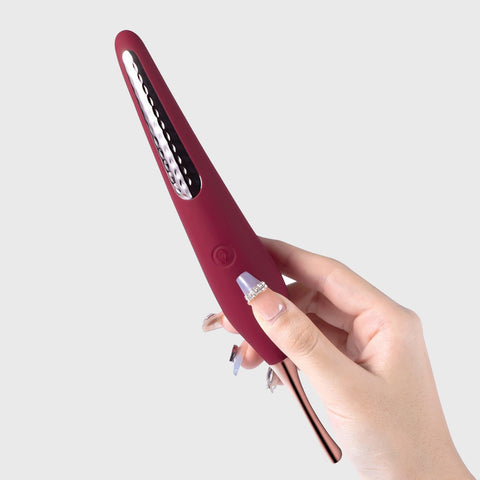 Hand holding Ms. Honey vibrator
