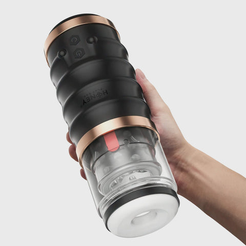 Person holding the Warrior automatic masturbator by Honey Play Box