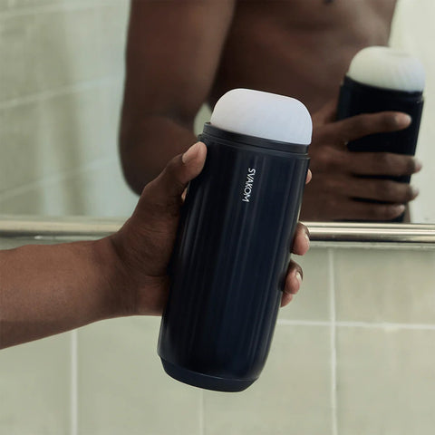 Sam Neo 2 Pro held in hand in front of mirror