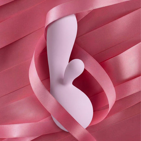 Purple rabbit vibrator surrounded by pink ribbons