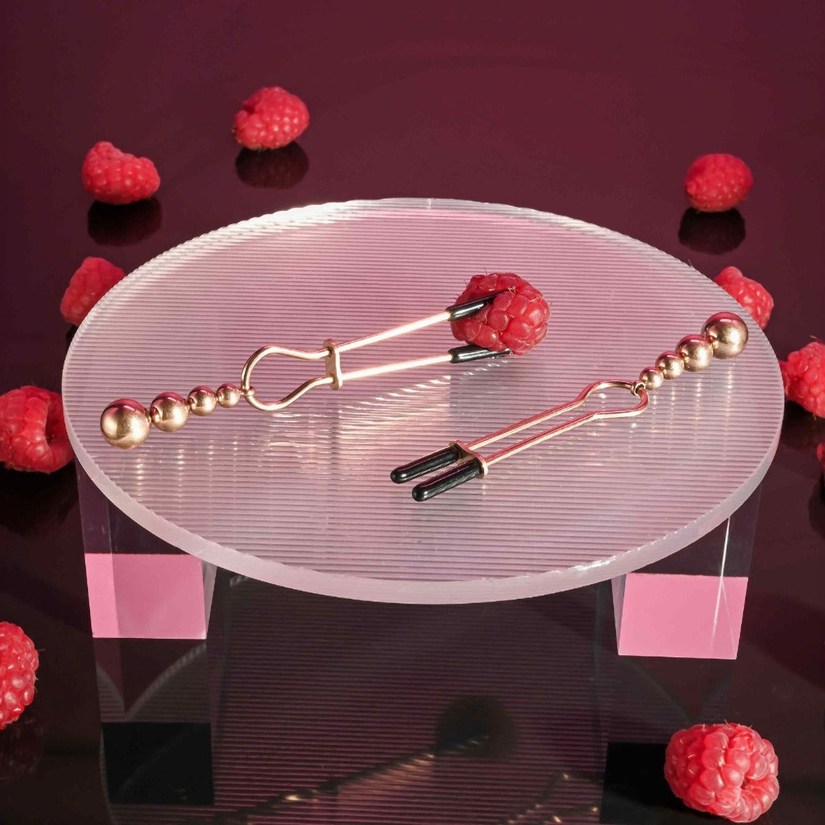Selopa Beaded Nipple Clamps in Rose Gold on table
