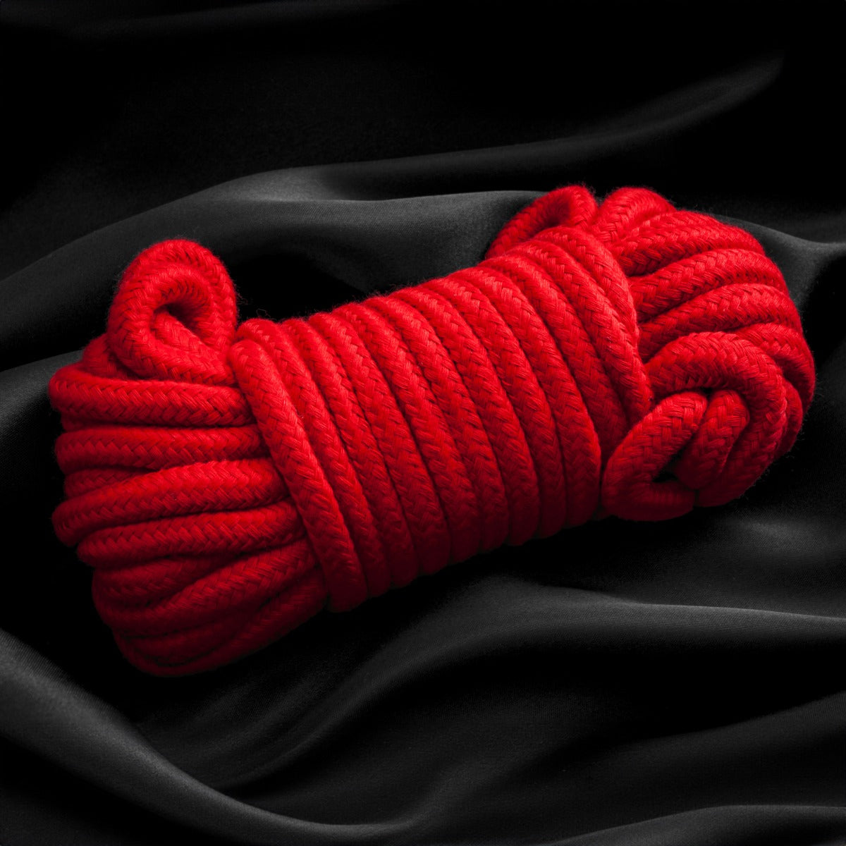 Spool of Liberator Bondage Rope on sheets