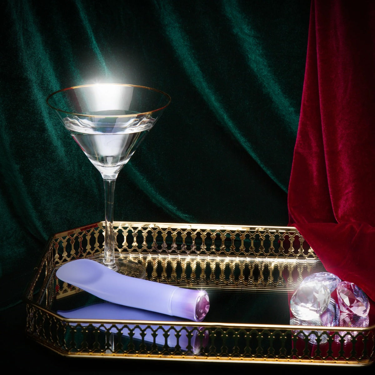 Oh My Gem Enrapture on table with gems and drink