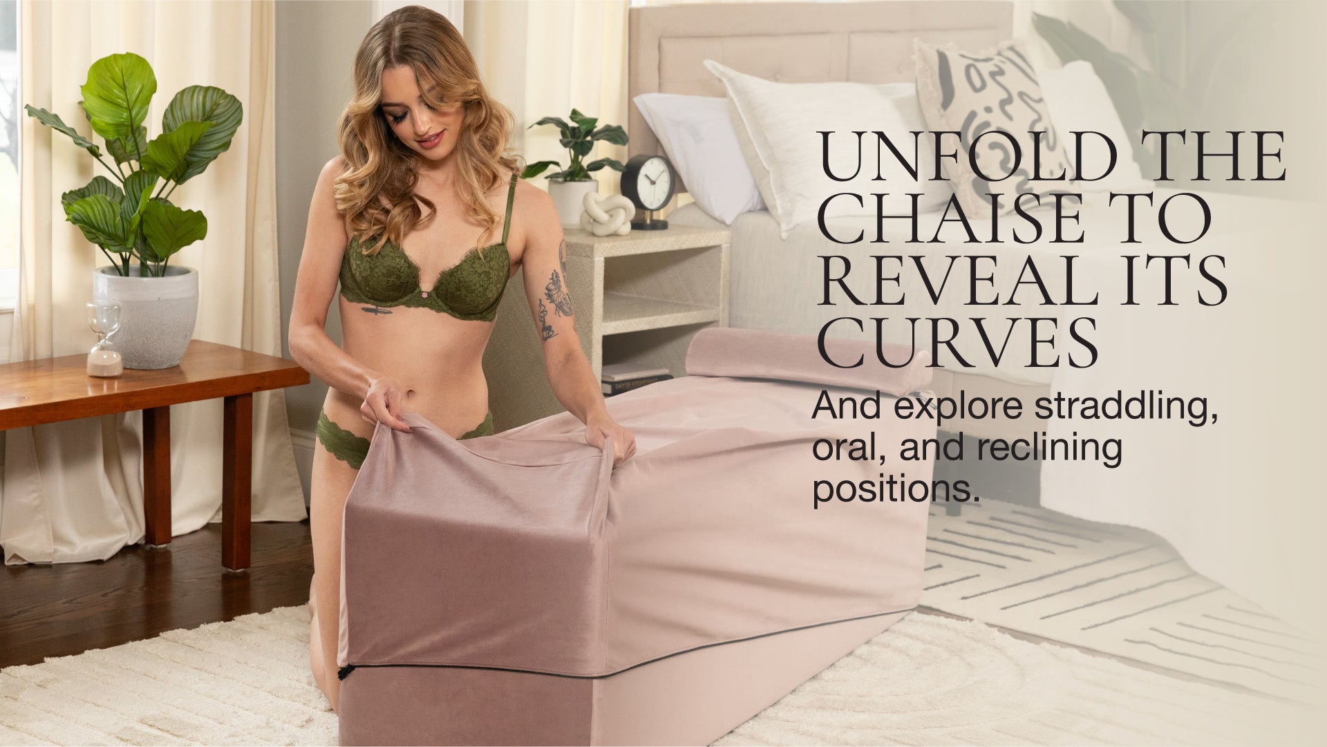 Woman in green lingerie unrolling a pink chaise in a bedroom setting.