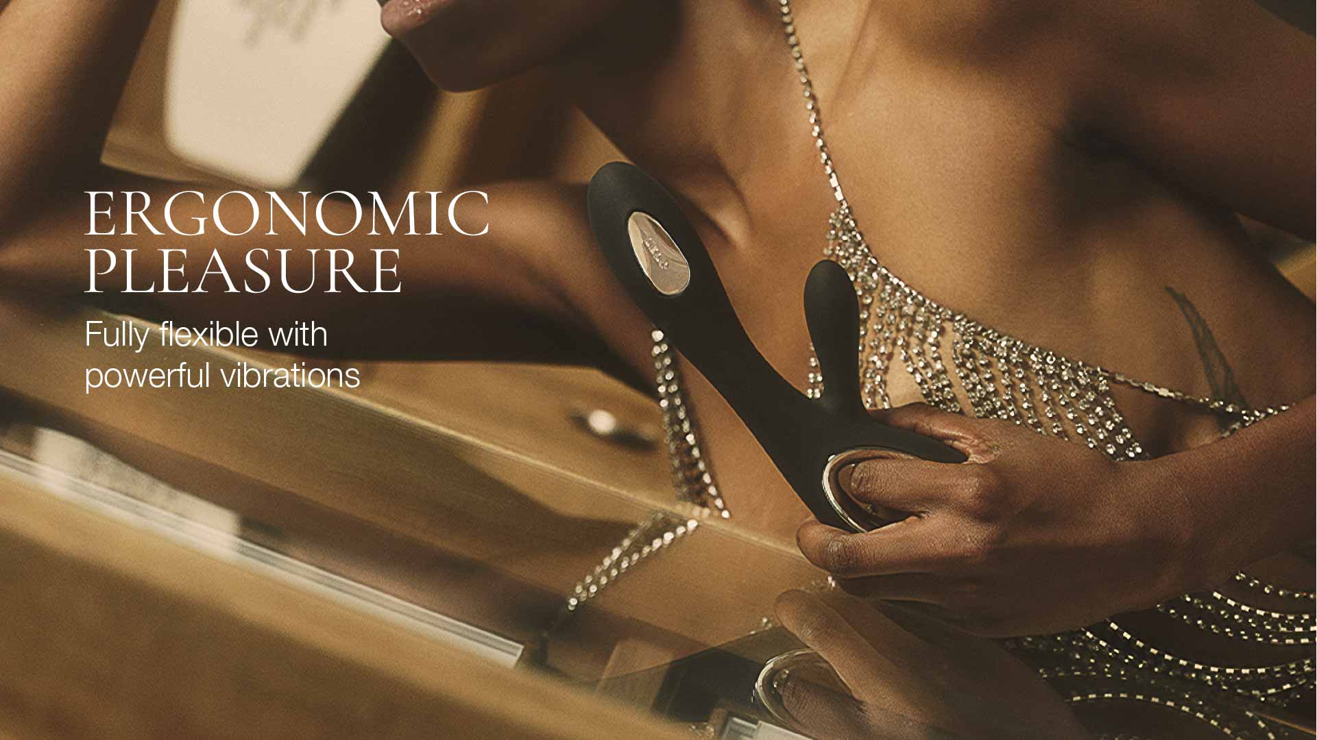Person holding a black ergonomic pleasure device with text overlay