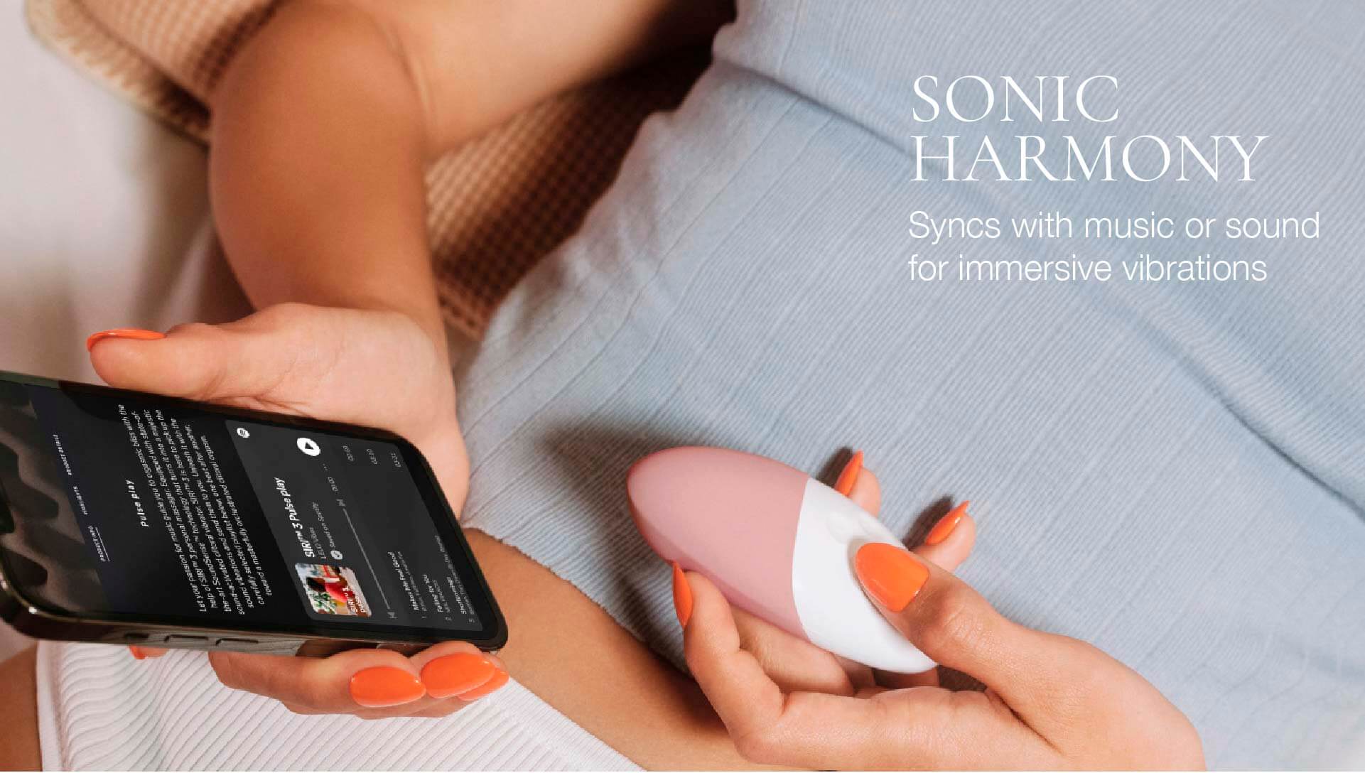 Person using a smartphone with a Sonic Harmony device on a blurred background