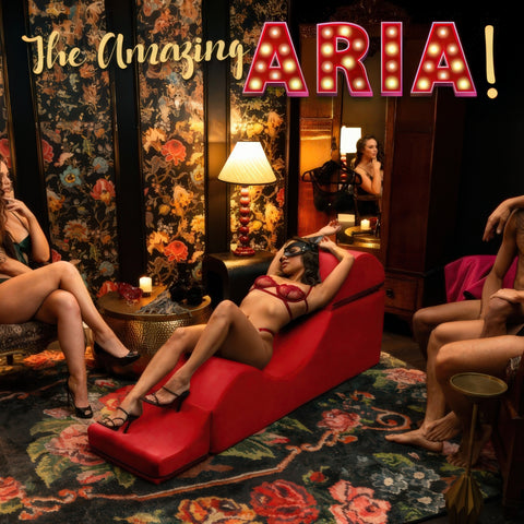 Woman in a red bikini lying on a red couch with 'The Amazing ARIA!' text above.