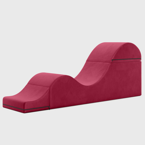 Red chaise lounge on a light gray background