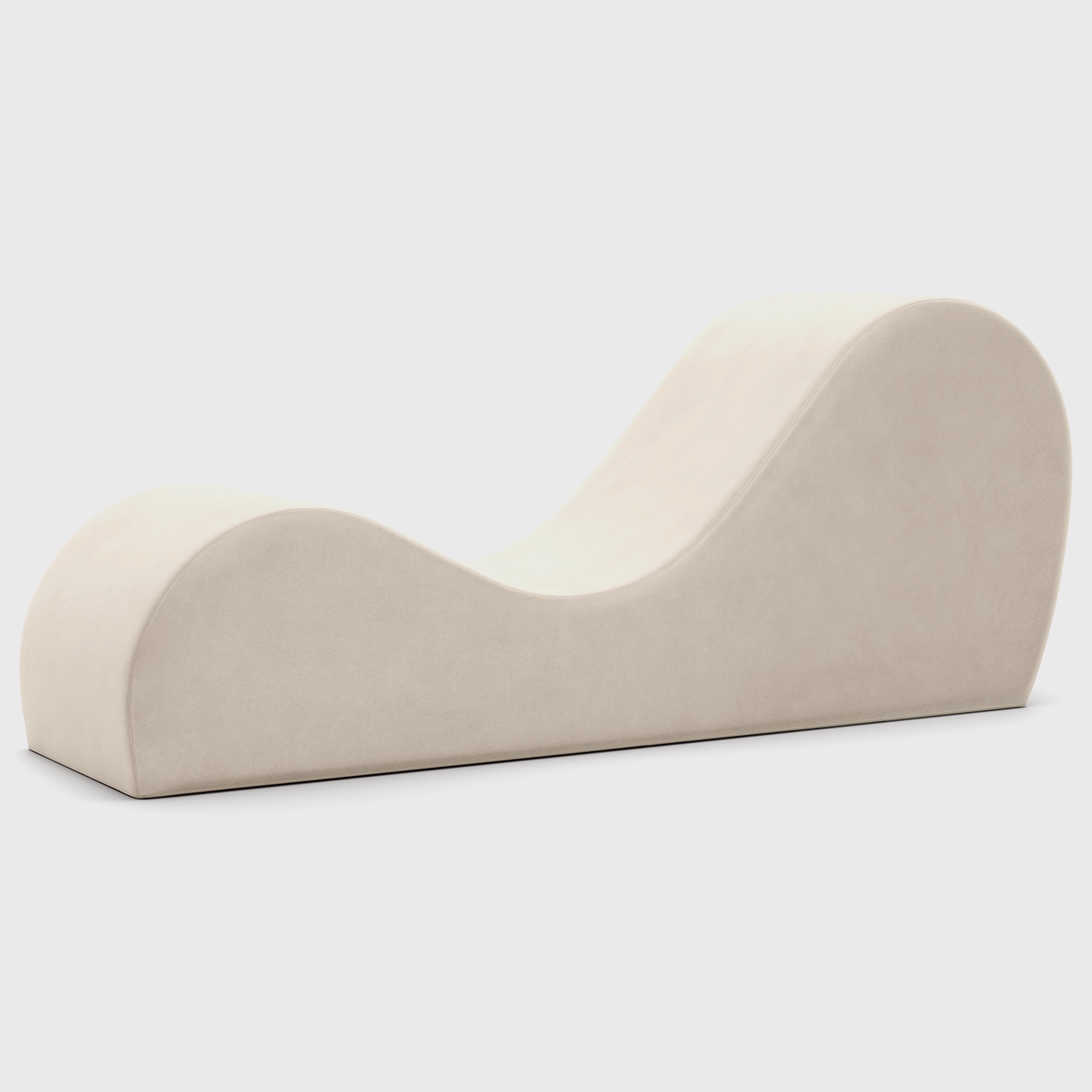 Beige curved chaise on a white background