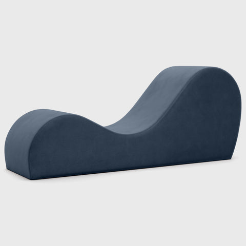 Blue curved chaise on a white background