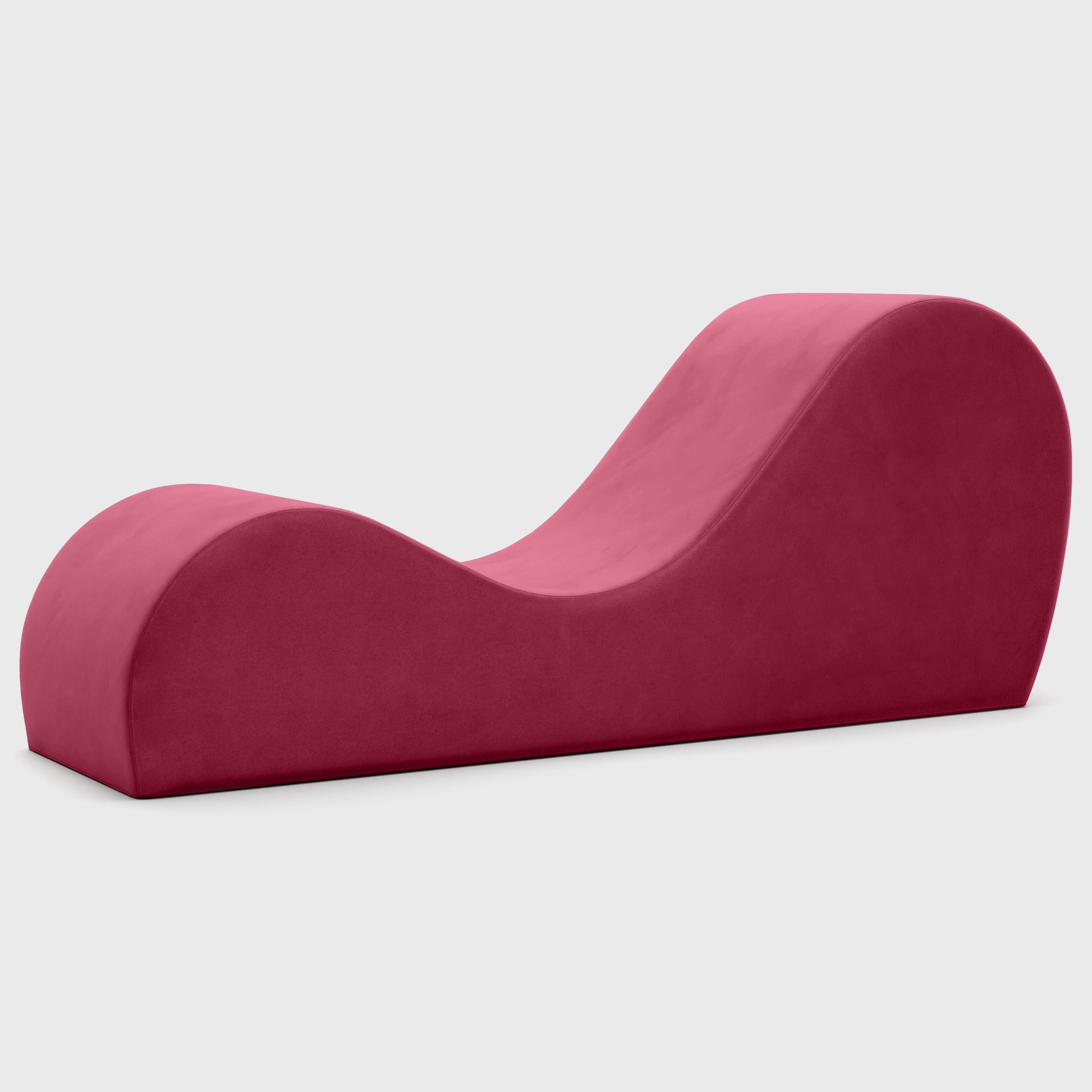 Pink curved chaise on a white background