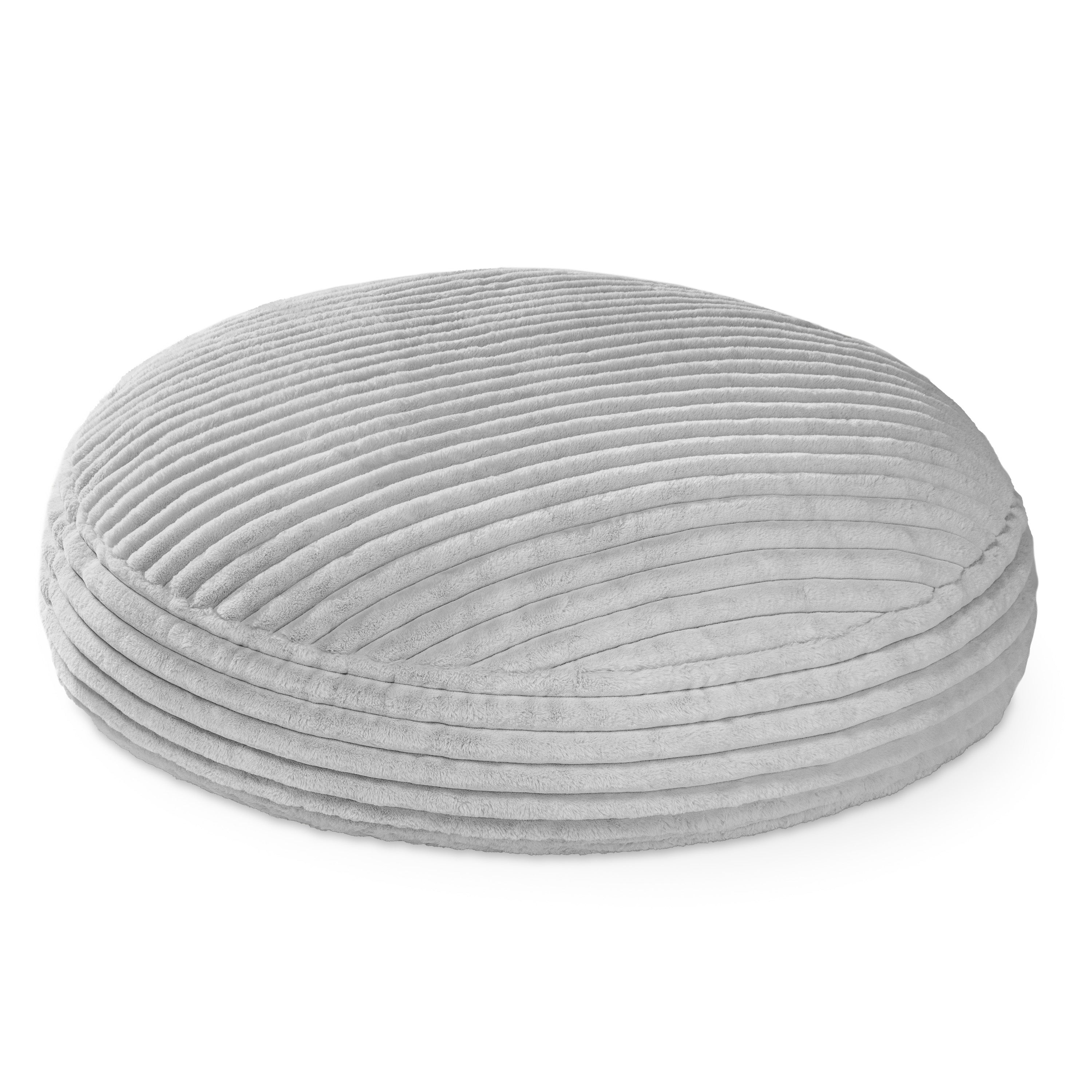 Round gray cushion with ribbed texture on a white background