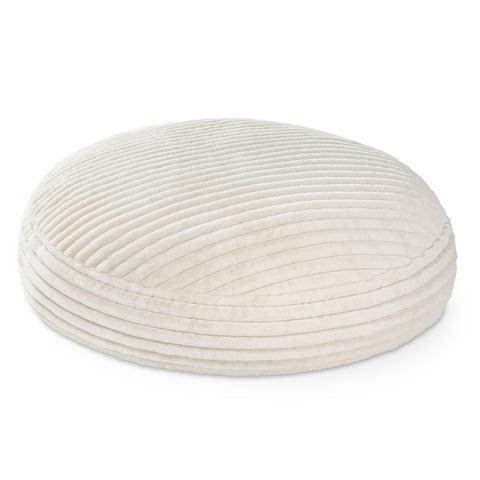 Round, beige fabric ottoman on a white background