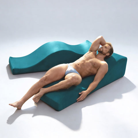 Man leaning back on Equus Wave in blue in white room