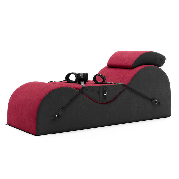Red and black pet carrier with straps on a white background