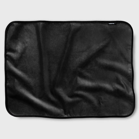 Black fabric mat on a light gray background