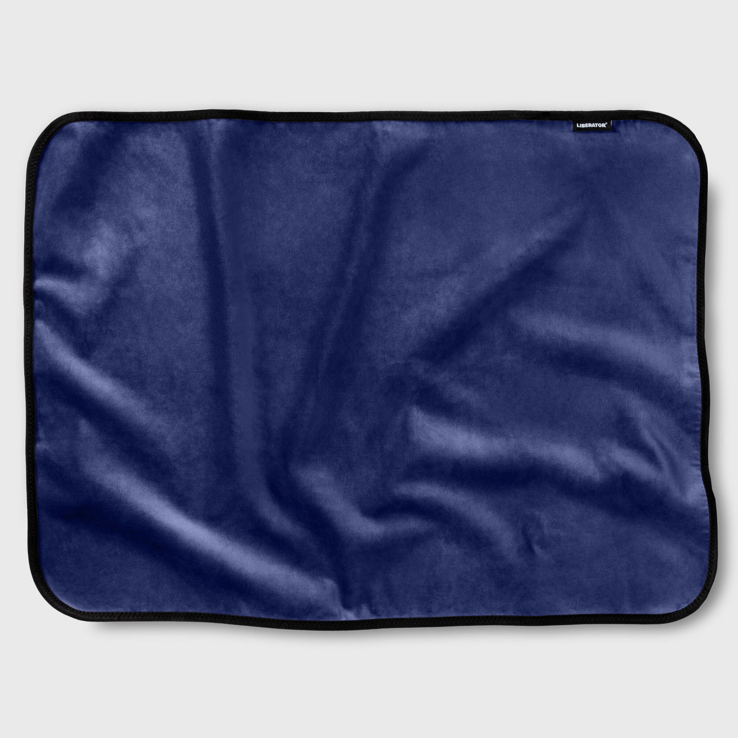 Navy blue satin fabric throw on a white background