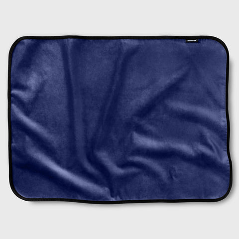 Navy blue satin fabric throw on a white background