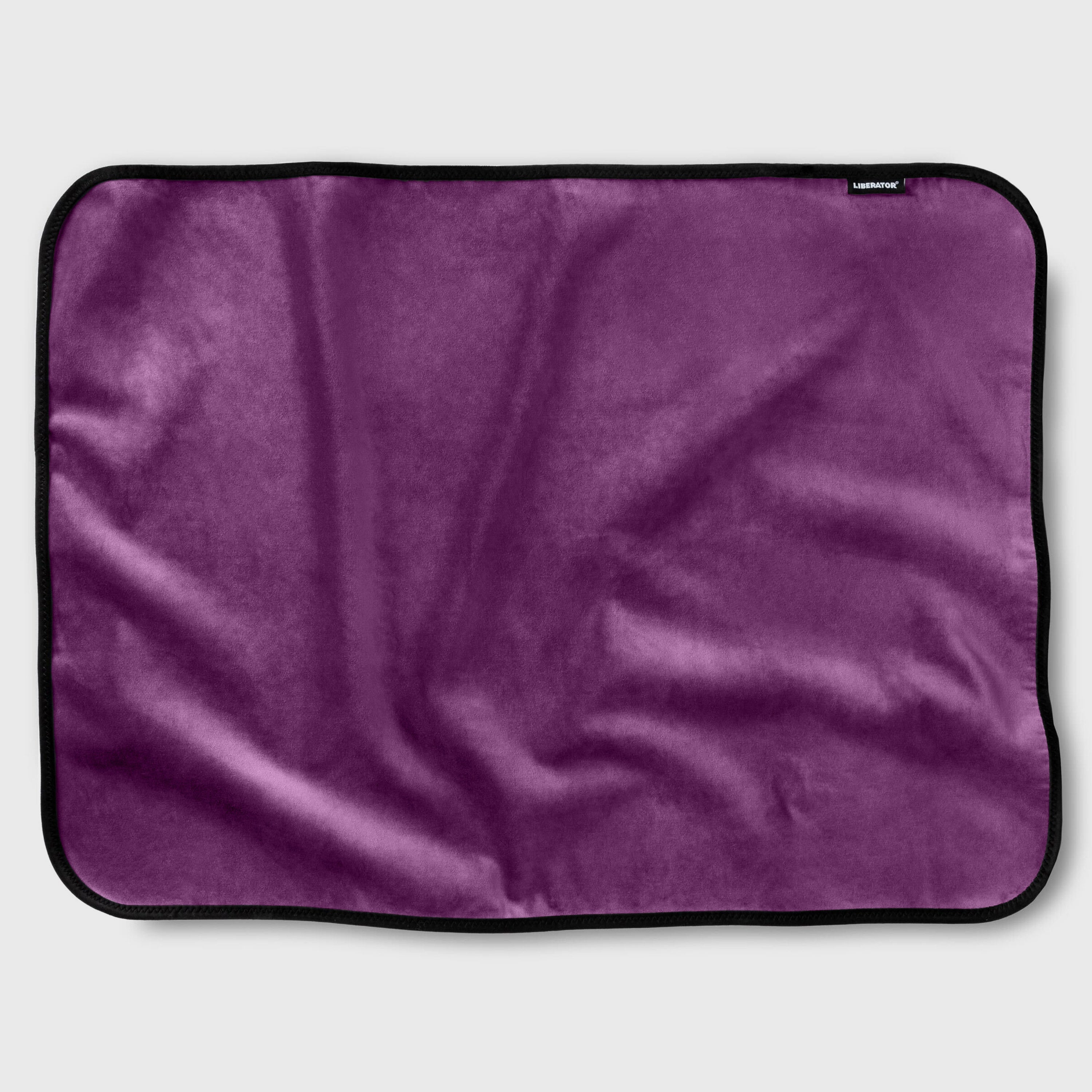 Purple blanket with a brand label on a light gray background