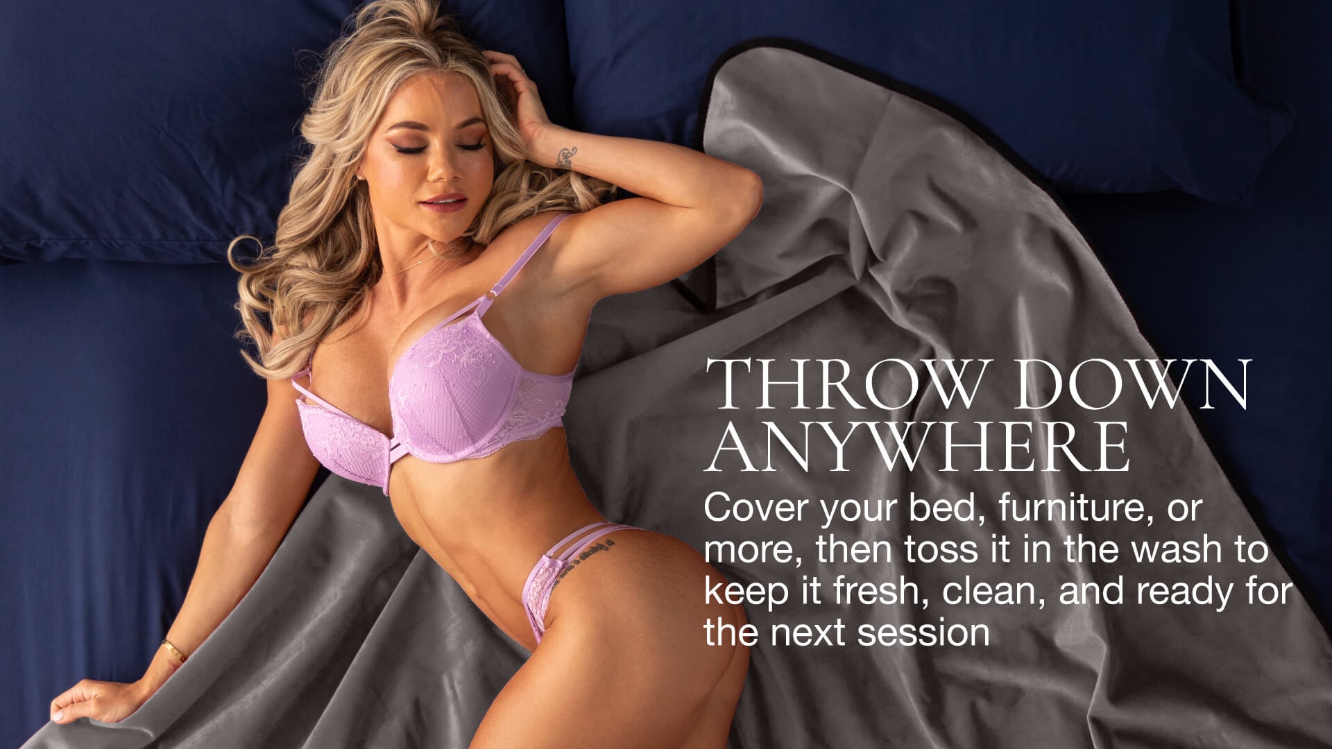Woman in pink lingerie lying on a gray throw blanket with text overlay.