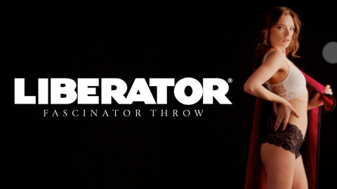 Model wearing a 'Liberator' fascinator throw against a black background
