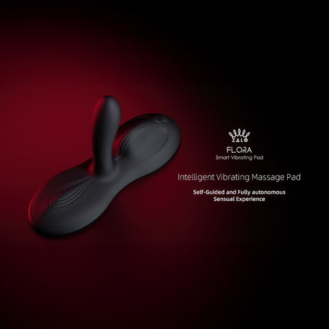 Zalo Flora App-Enabled Lay On Vibrator on a red and black gradient background with the words Intelligent Vibrating Massage Pad, Self-guided and fully autonomous sensual experience.