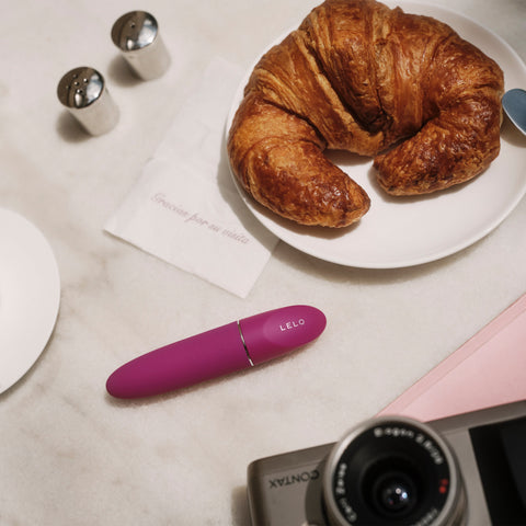 MIa 3 on table next to croissant